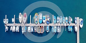 Panoramic Aerial view on boats moored in the pier, drone shot directly above.