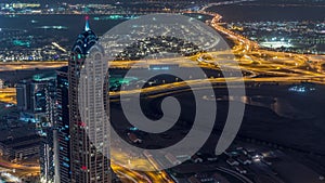 Panoramic aerial view of business bay towers in Dubai night timelapse.