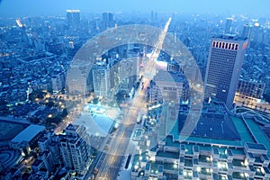 Panoramic aerial view of busy Taipei City, Taipei commerical area, Tamsui River and downtown area at dusk