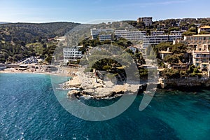 Panoramic aerial view on cliffs, blue sea, beach, houses, streets and old fisherman`s harbour with lighthouse in Cassis, Provence