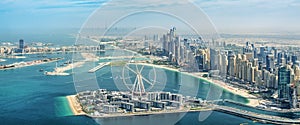 Panoramic aerial view of Dubai Marina skyline with Dubai Eye ferris wheel, UAE