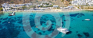 Panoramic aerial view of the famous celebrity beach Psarou on the island of Mykonos, Greece