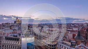 Panoramic aerial view of Gran Via day to night timelapse, Skyline Old Town Cityscape, Metropolis Building, capital of