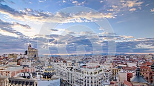 Panoramic aerial view of Gran Via timelapse at sunset, Skyline Old Town Cityscape, Metropolis Building, capital of Spain photo