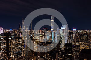 Panoramic aerial view of group of skyscraper near central park. Modern high rise buildings in night city. Manhattan, New