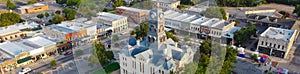 Panoramic aerial view historic Hood County Courthouse and Clock Tower in downtown Square Granbury, Texas, USA