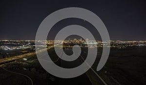 Panoramic aerial view on illuminated skyline of Fort Worth over West Fork Trinity River at night