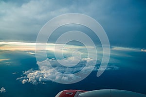 Panoramic aerial view. landscape view from airplane window. Airliner flying in high cloudy sky. airplane is flying in the blue sky