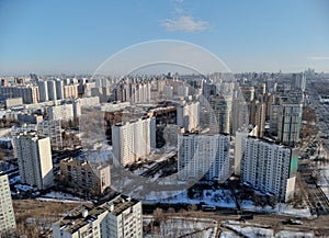 Panoramic aerial view on the Leningradsky Highway on a cold sunny day in winter. Beautiful urban landscape river covered with ice