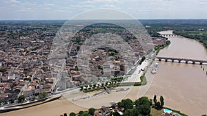 Panoramic aerial view of Libourne city on Dordogne river on sunny summer day, Gironde, France