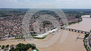 Panoramic aerial view of Libourne city on Dordogne river on sunny summer day, Gironde, France