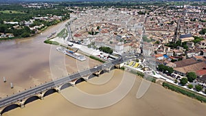 Panoramic aerial view of Libourne city on Dordogne river on sunny summer day, Gironde, France