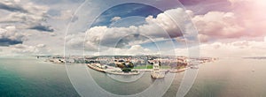 Panoramic aerial view of Lisbon Belem Tower and cityscape at sunset