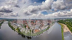 Panoramic aerial view of Lubeck cityscape on a cloudy day, Germany