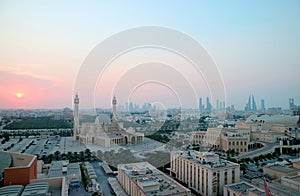 Panoramic Aerial View of Manama with the Al Fateh Grand Mosque and Group of Iconic Landmarks against Sunset Sky