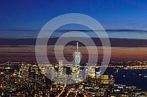 Panoramic and Aerial View of Manhattan, New York City at Night. Illuminated Buildings After Sunset.