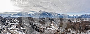Panoramic aerial view of Mochsberg top with view of Untersberg snow mountain in Salzburg winter
