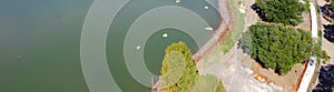 Panoramic aerial view neighborhood pond under remodeling construction in Flower Mound, Texas, USA