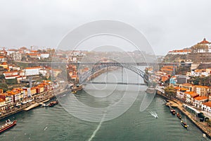 Panoramic aerial view of old houses of Porto, Portugal with Luis I Bridge - a metal arch bridge