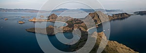 Panoramic aerial view of `Padar Island` in sunrise from Komodo Island, Komodo National Park, Labuan Bajo, Flores, Indonesia. in