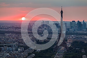 Panoramic aerial view of Paris, Eiffel Tower and La Defense business district. Aerial view of Paris at sunset. Panoramic view of