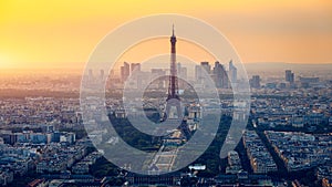 Panoramic aerial view of Paris, Eiffel Tower and La Defense business district. Aerial view of Paris at sunset. Panoramic view of