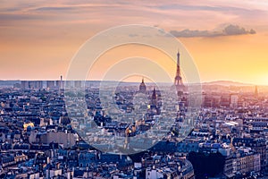 Panoramic aerial view of Paris, Eiffel Tower and La Defense business district. Aerial view of Paris at sunset. Panoramic view of