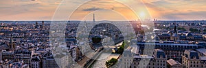 Panoramic aerial view of Paris, Eiffel Tower and La Defense business district. Aerial view of Paris at sunset. Panoramic view of