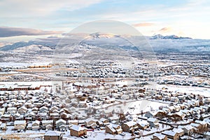 Panoramic aerial view of scenic neighborhood in the snowy valley on a winter day