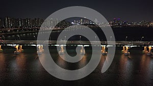 Panoramic aerial view of Seoul Han River at night glimmers under city lights Han River at night vein through