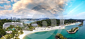 Panoramic aerial view of Siloso Beach and Sentosa Island at sunset, Singapore