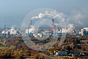 panoramic aerial view of the smoke of pipes as background of huge residential complex with high-rise buildings and private sector