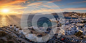 Panoramic aerial view to the beautiful windmills on Mykonos, Greece, during sunset