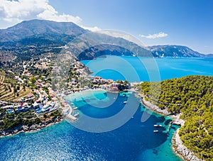 Panoramic aerial view to the picturesque fishing village of Assos, Kefalonia, Greece. Travel sailing boats moored over