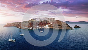 Panoramic aerial view to the villages of Oia during sunset time