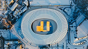 Panoramic aerial view of winter stadium with illumination lights