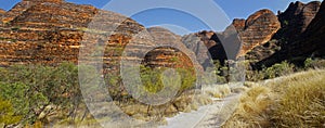 Panoramic Australian landscape with geological feature of rolling hills with the path