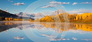 Panoramic autumn landscape with forest stream, river and mountains