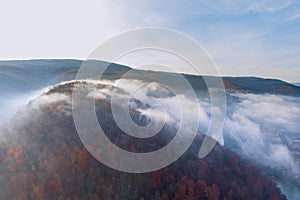 Panoramic of autumn natural mountain landscape the fantastic scenery with morning fog in forest