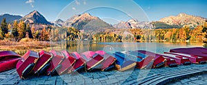 Panoramic autumn view of Strbske pleso lake. Picturesque evening scene of High Tatras National Park, Slovakia, Europe. Beauty of n