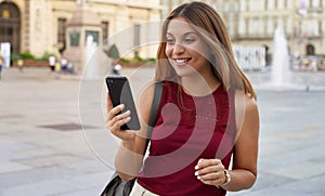 Panoramic banner of surprised young woman using telephone for watching video or stories. Cropped view