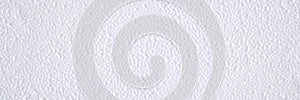 Panoramic banner of White Polystyrene or styrofoam texture background. Styrofoam board for backdrop. Copyspace for text. Defocused