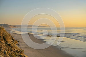 Panoramic beach view at Del Mar Southern California with people enjoying the sunset