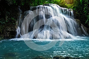 Panoramic beautiful deep forest waterfall at environment with flowing fresh nature outdoor in Thailand ,Natural light/Concept