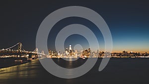 Panoramic beautiful scenic view of the Oakland Bay Bridge and the San Francisco city in the evening, California, USA