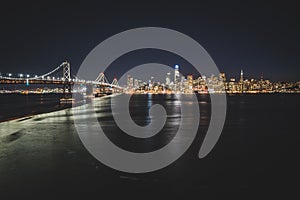 Panoramic beautiful scenic view of the Oakland Bay Bridge and the San Francisco city in the evening, California