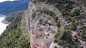 Panoramic beautiful vertiginous aerial view of wooden staircase at rock cliff as