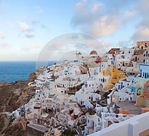 Panoramic beautiful view of Oia town on Santorini island, Cyclades, Greece. Traditional famous white houses, windmills and