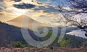 Panoramic beautiful view view of the mountains at sunset. evening cloudy view of the volcano ?gung, Bali