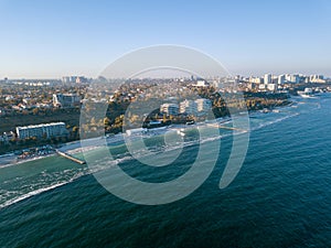 Panoramic bird`s eye arial view from drone the coastline of a developed city Odesa, Ukraine. Copy space. photo